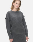 Redefine your knitwear collection with this versatile gray sweater, boasting a round-neck design and a simple yet stylish silhouette.