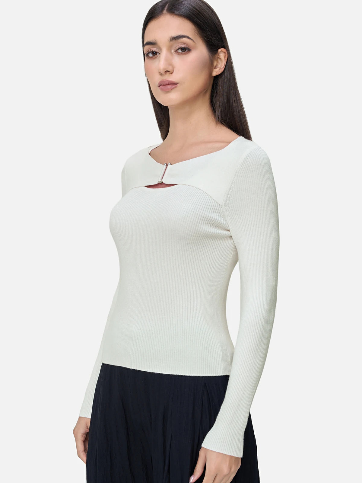 Elevate your wardrobe with this chic white knit sweater, showcasing avant-garde hollow-out detailing for a modern and stylish look.