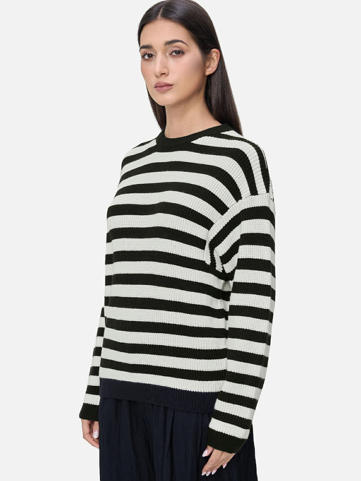 Elevate your wardrobe with this chic sweater, featuring classic black and white stripes, ribbed texture, and a comfortable round neckline for a timeless and stylish look.