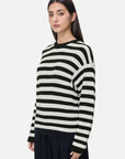 Elevate your wardrobe with this chic sweater, featuring classic black and white stripes, ribbed texture, and a comfortable round neckline for a timeless and stylish look.