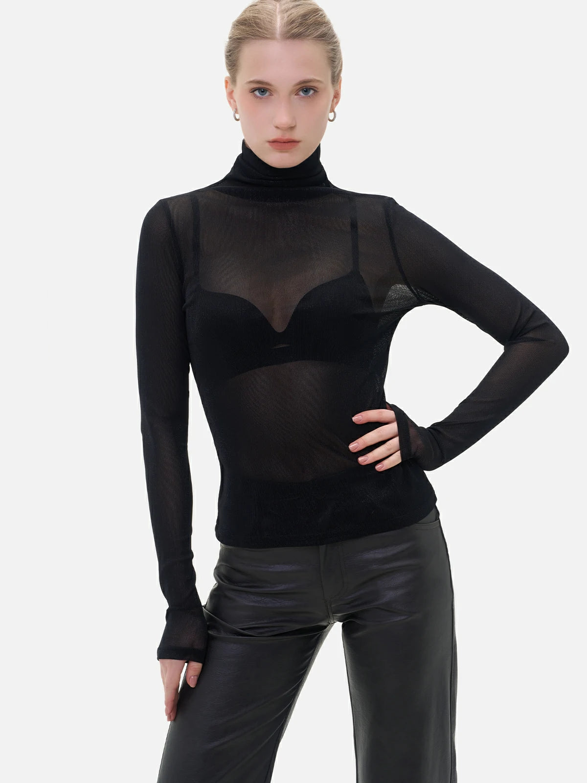 Elevate your style with this high-neck sheer mesh top, a slim-fit black designed for both elegance and allure.