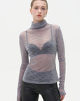 Stylish high-neck sheer base layer with delicate diamond pattern.