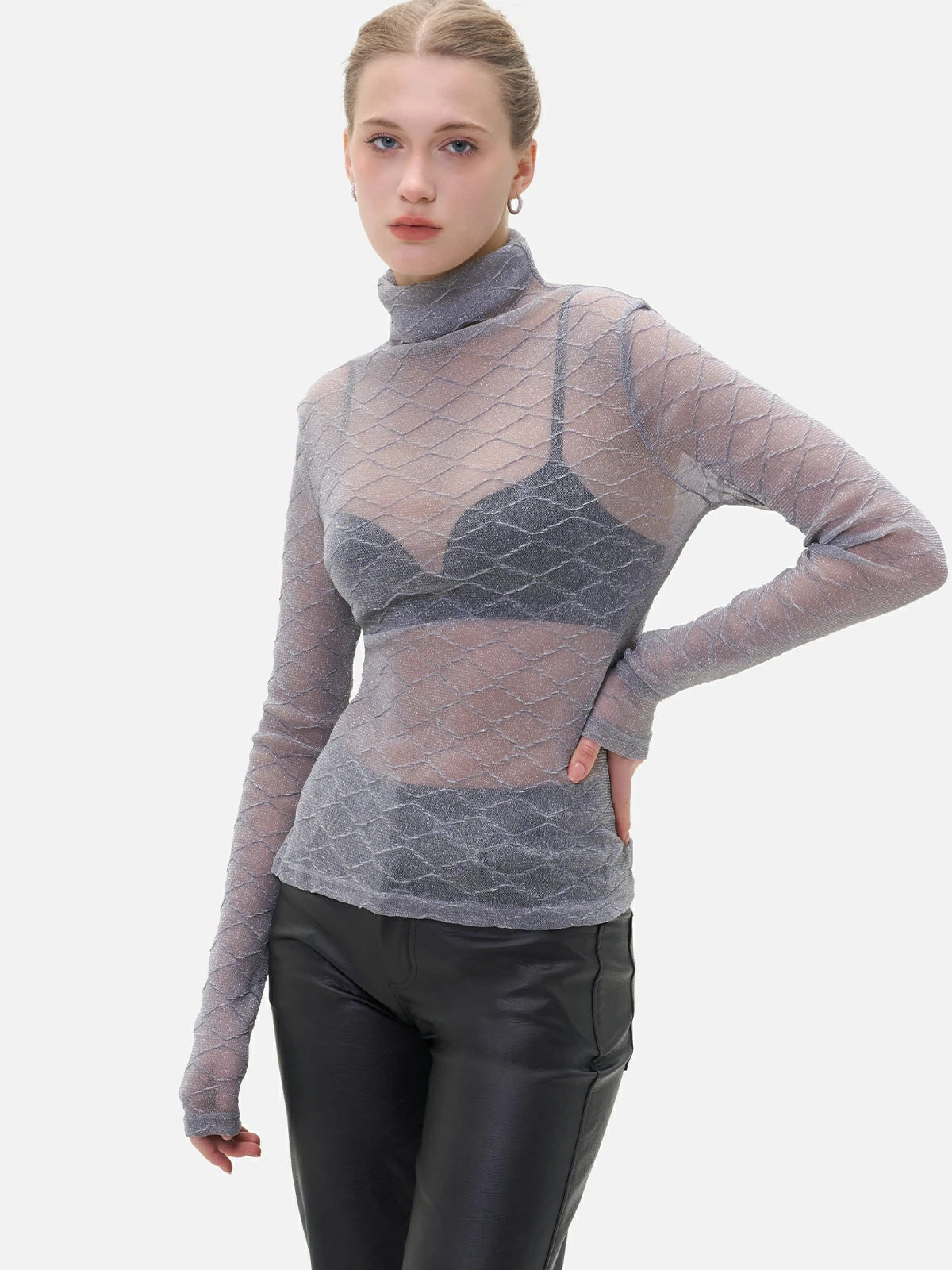 Chic feminine style embodied in a sheer base layer adorned with a delicate diamond pattern.