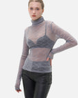 Chic feminine style embodied in a sheer base layer adorned with a delicate diamond pattern.