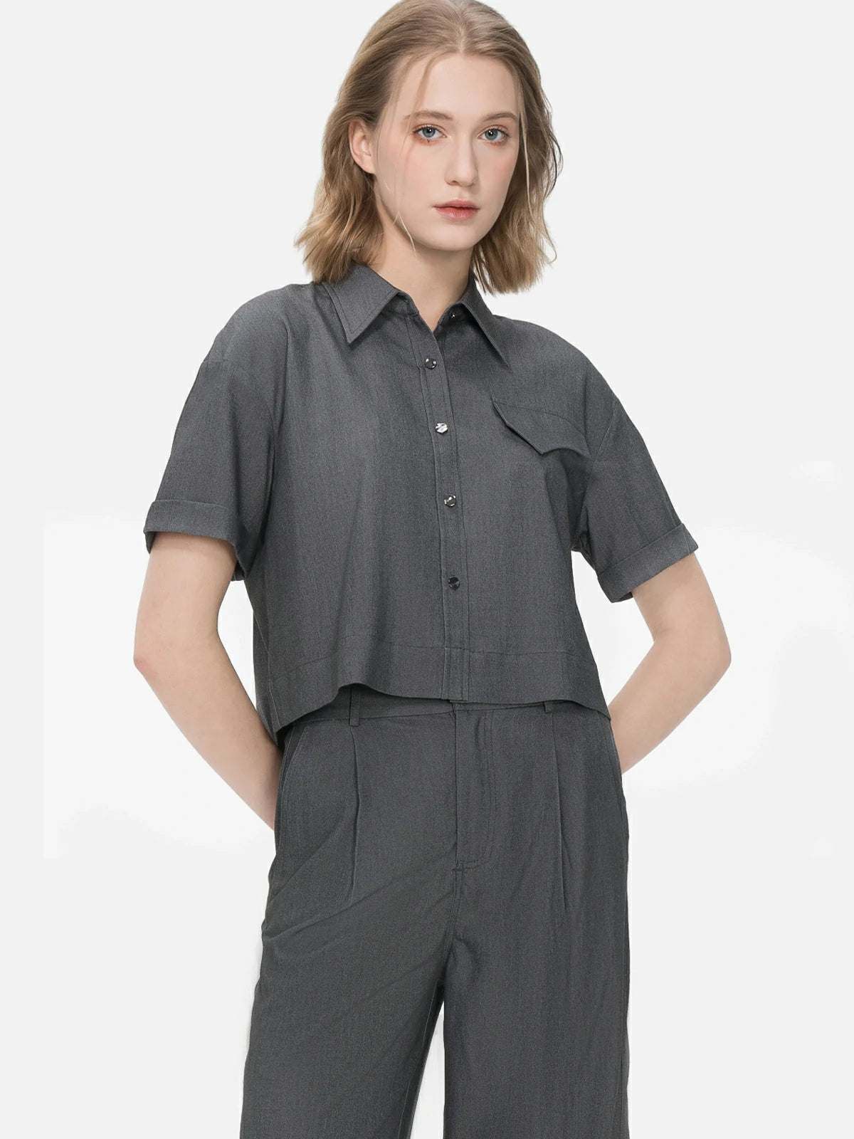 Faux pocket patchwork lapel collar shirt with rolled cuff design, combining unique aesthetics with casual comfort for a fashionable summer look.