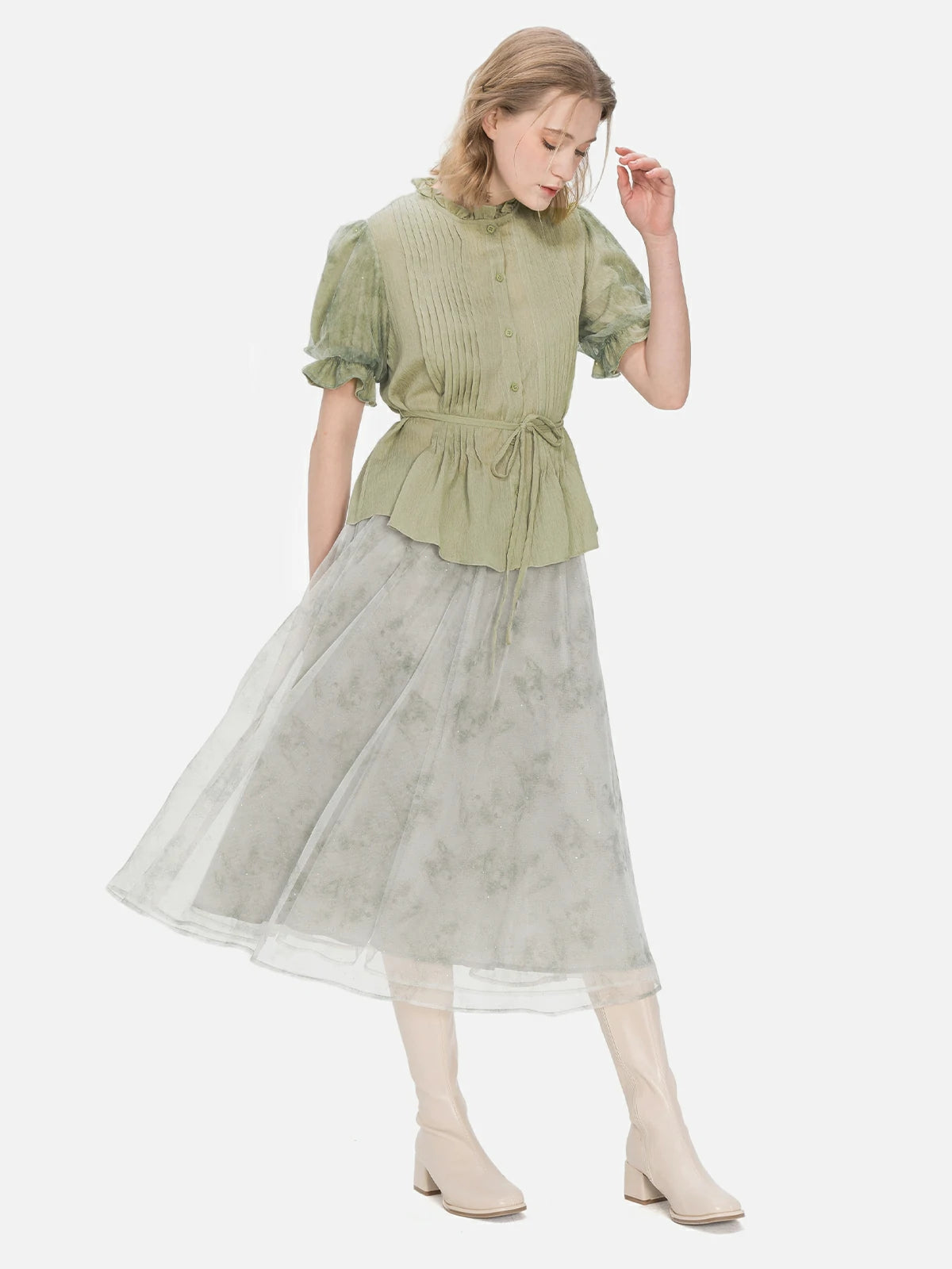 Fashion-forward short-sleeved blouse in green, featuring mesh bubble sleeves and a waist tie, perfect for versatile and chic styling.
