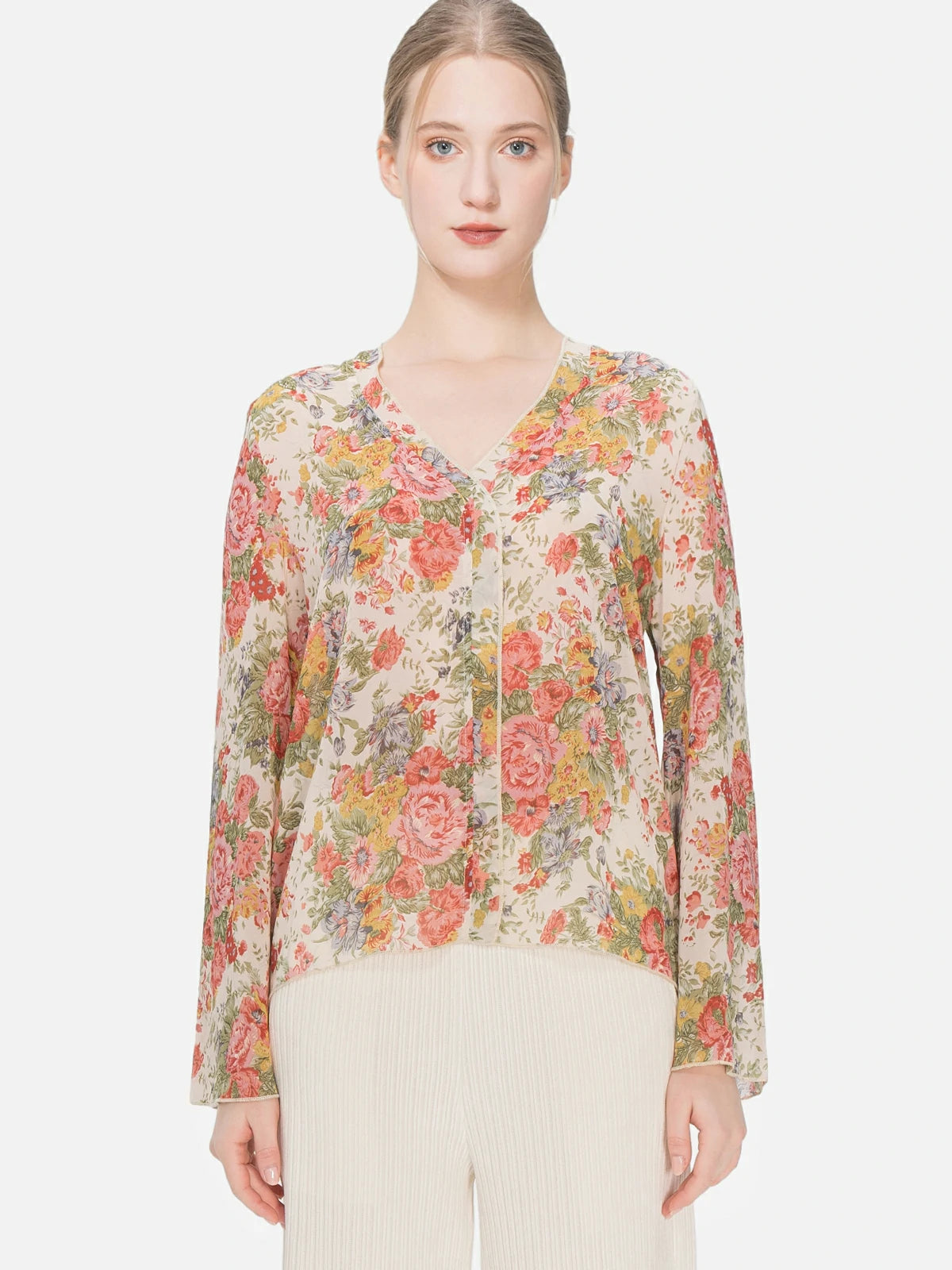 Lightweight Bohemian blouse with floral print and V-neck design, creating an ethereal and feminine look suitable for a romantic and casual fashion statement.