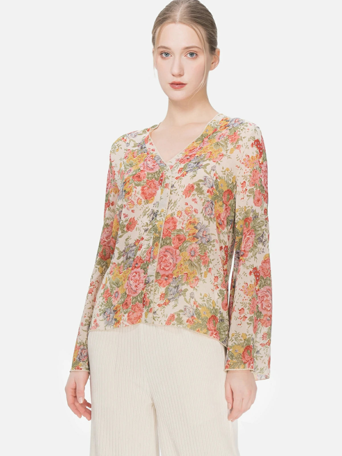 Versatile Bohemian-inspired blouse featuring a floral print, V-neck design, and lightweight fabric, offering both comfort and artistic style for various occasions.
