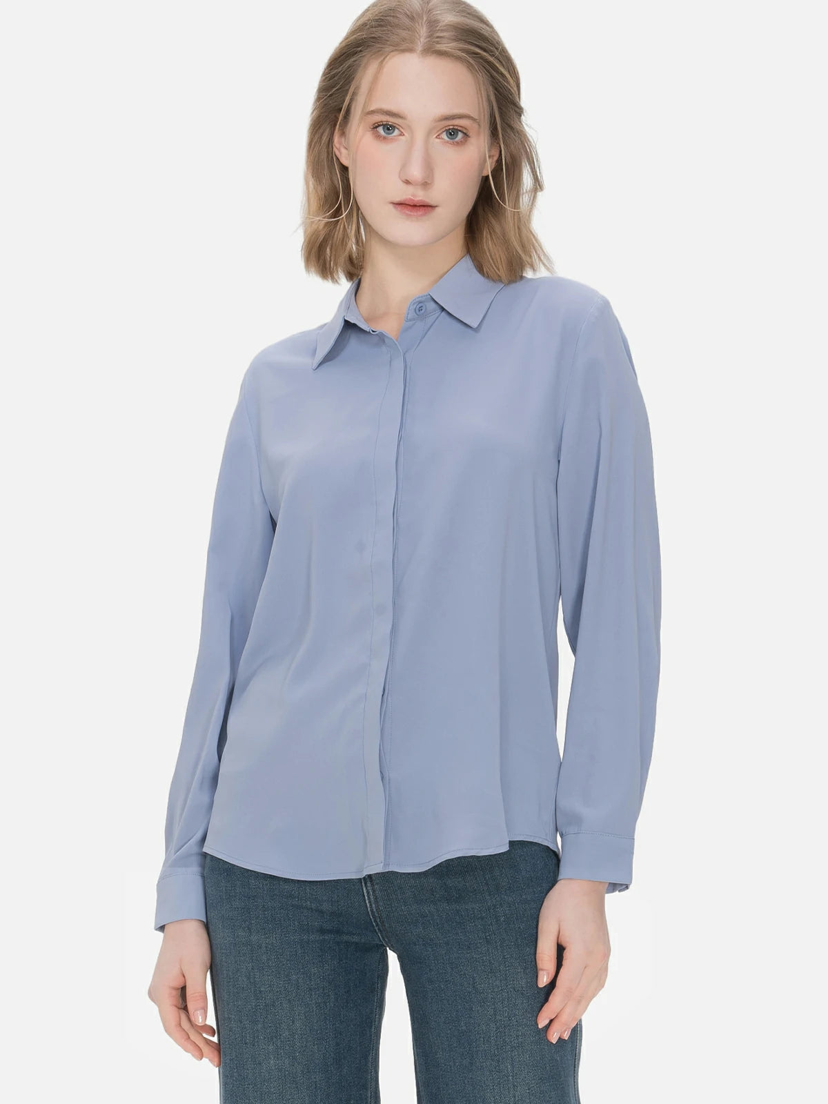 Elegant blue chiffon shirt with a turnover collar, presenting a feminine and graceful ambiance, suitable for versatile styling in both casual and formal settings.