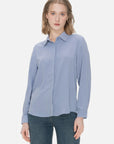 Elegant blue chiffon shirt with a turnover collar, presenting a feminine and graceful ambiance, suitable for versatile styling in both casual and formal settings.