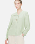 Experience feminine elegance in this V-neck chiffon blouse, adorned with pleated cuffs and a refreshing green color.