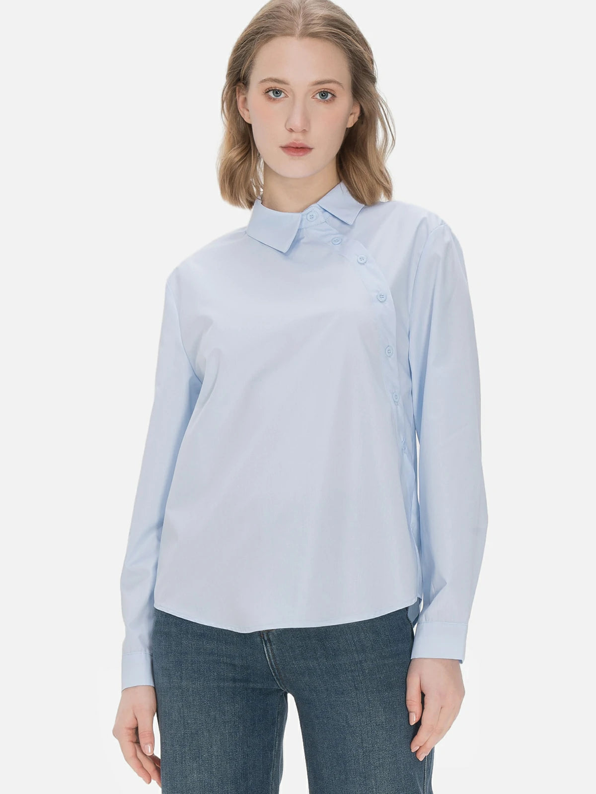 Stylish ladies&#39; collared shirt with a unique diagonal button design and classic blue color, perfect for a fashionable and elegant look on various occasions.