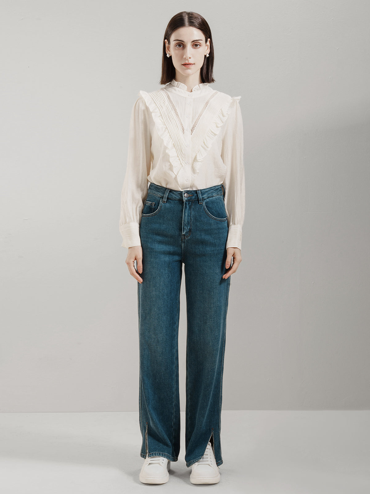 Vintage-inspired white ruffled blouse with lace details and high neckline