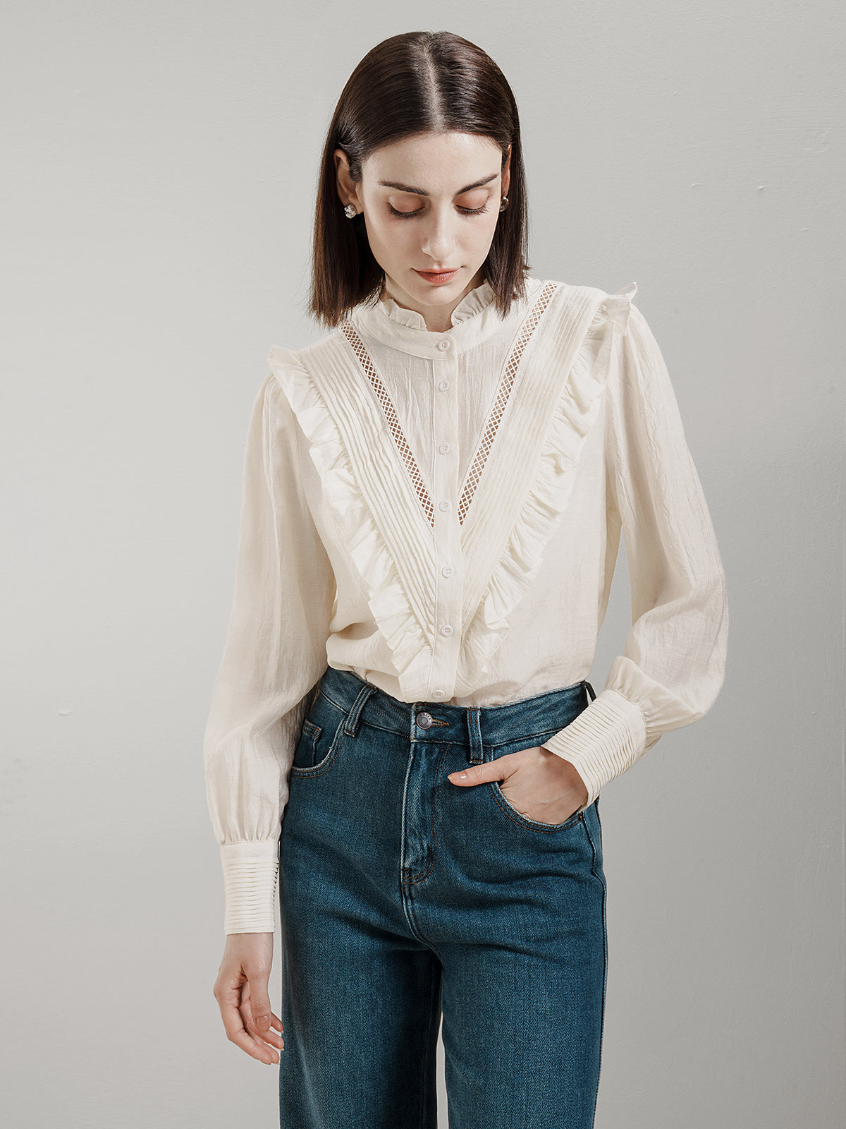 Elegant Victorian-style button-up shirt with ruffle trim and pintuck pleats