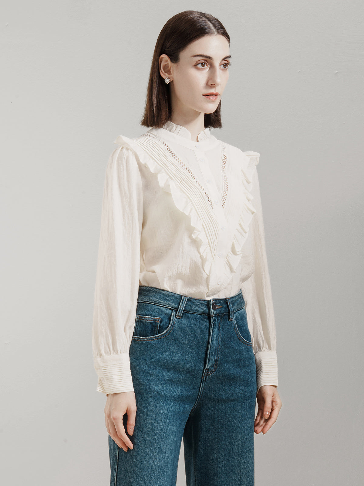 Classic feminine blouse with a frilled front and structured button-down design