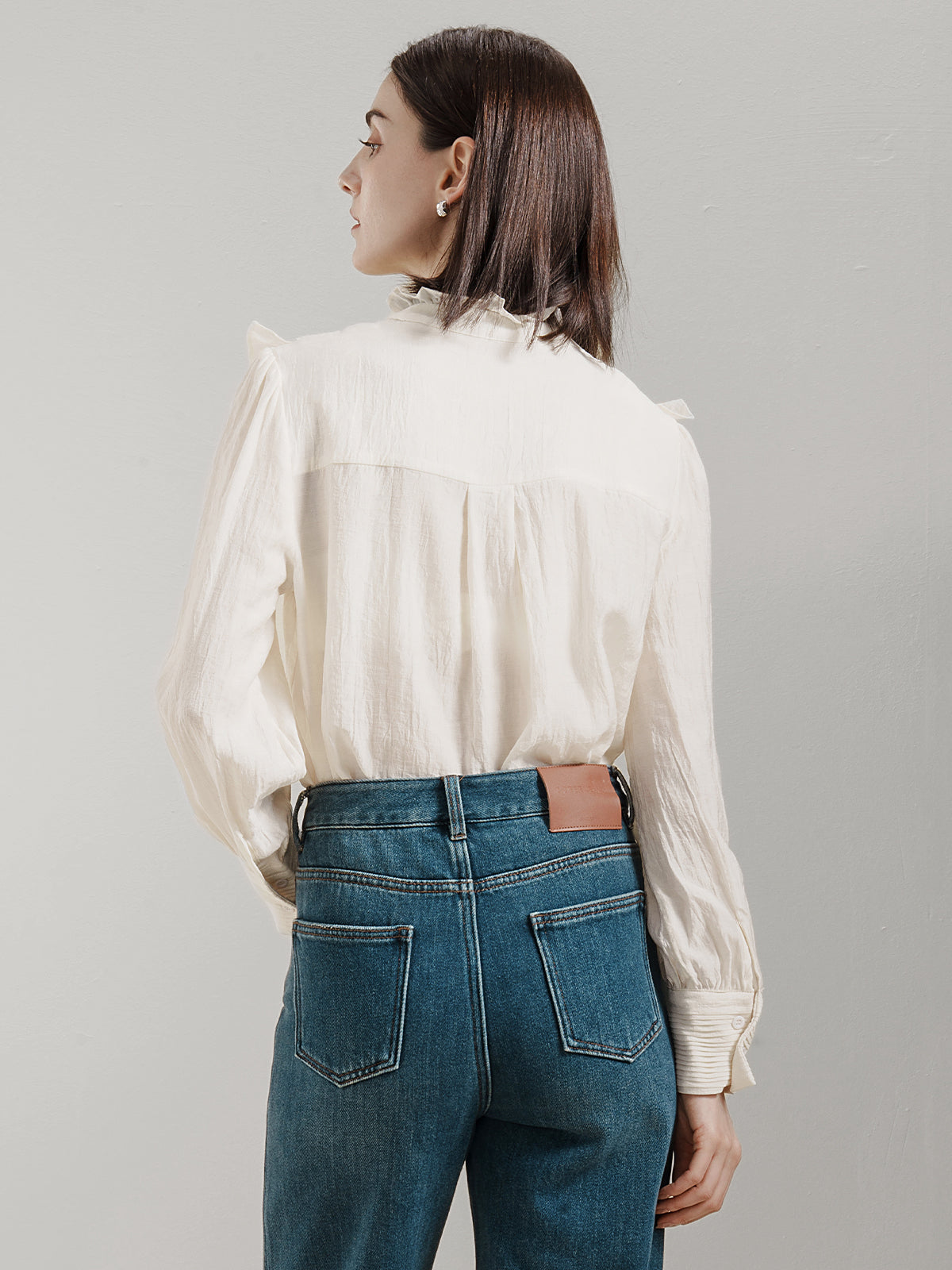 Romantic white ruffle shirt with delicate lace inserts and pleated cuffs