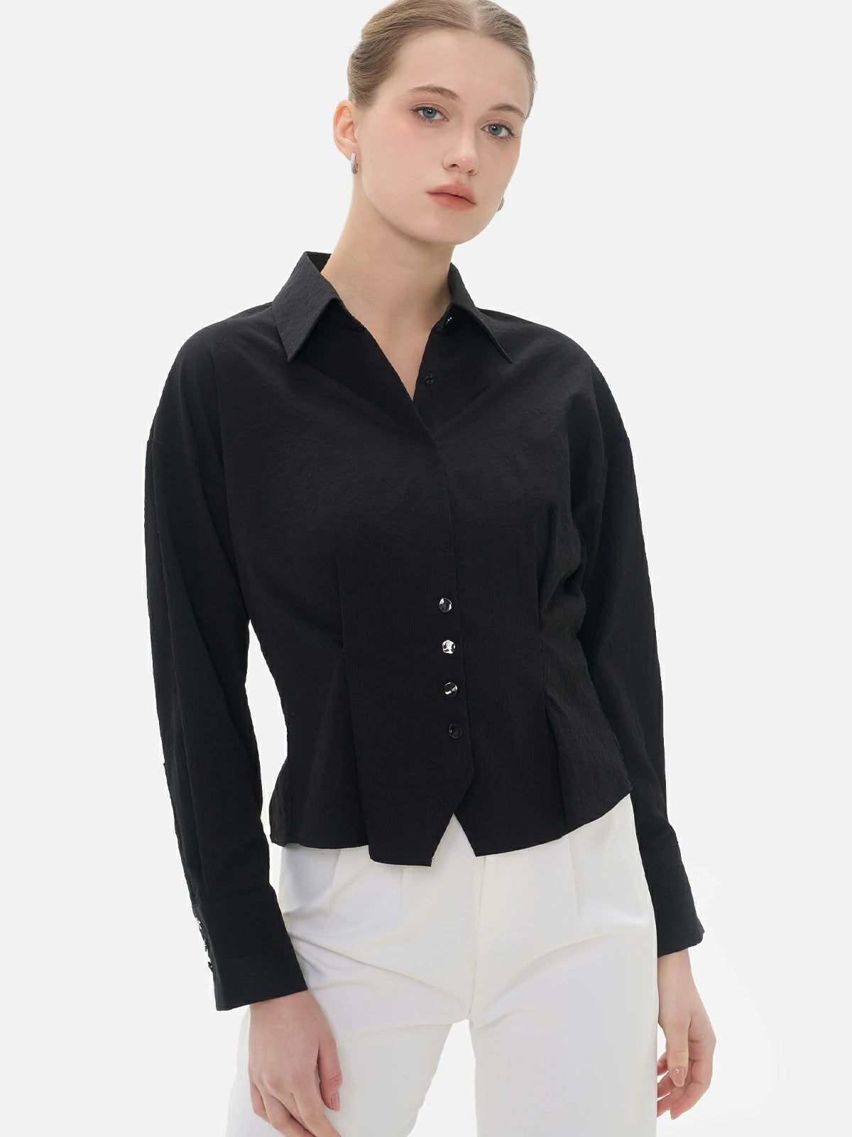 Stylish black collared shirt with textured surface for a unique look