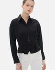 Stylish black collared shirt with textured surface for a unique look
