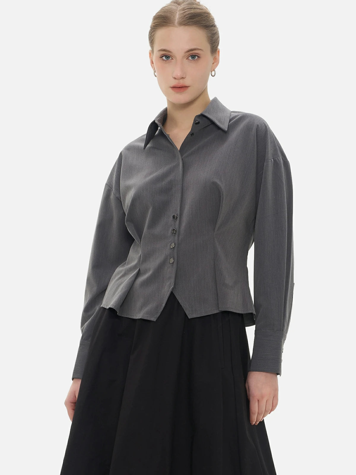 Elevate your style with this collared blouse featuring a pleated design, cinched waist, and dropped-shoulder sleeves.
