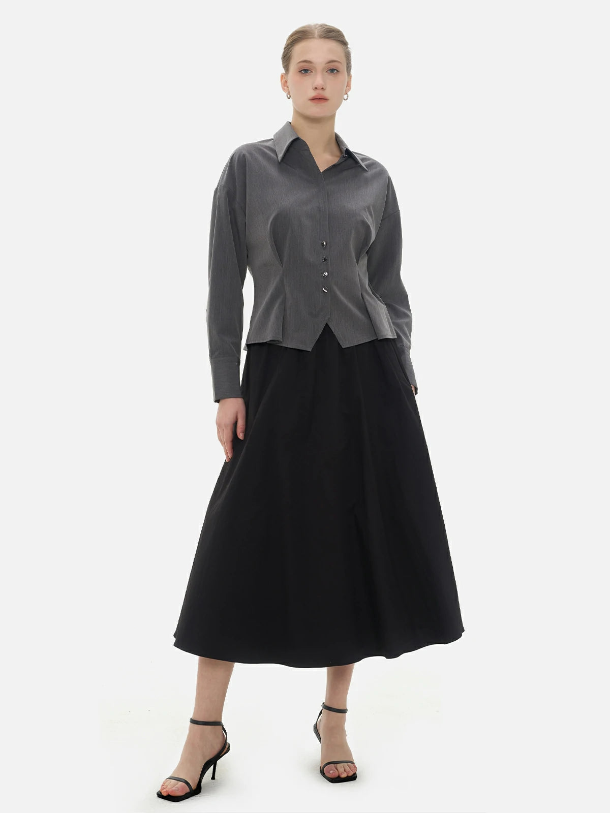 Infuse your look with elegance and style in this collared blouse, featuring pleats, a cinched waist, and dropped-shoulder sleeves.