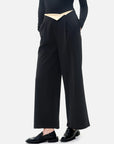 Stylish black wide-leg pants with a waistband flip and color-blocking design