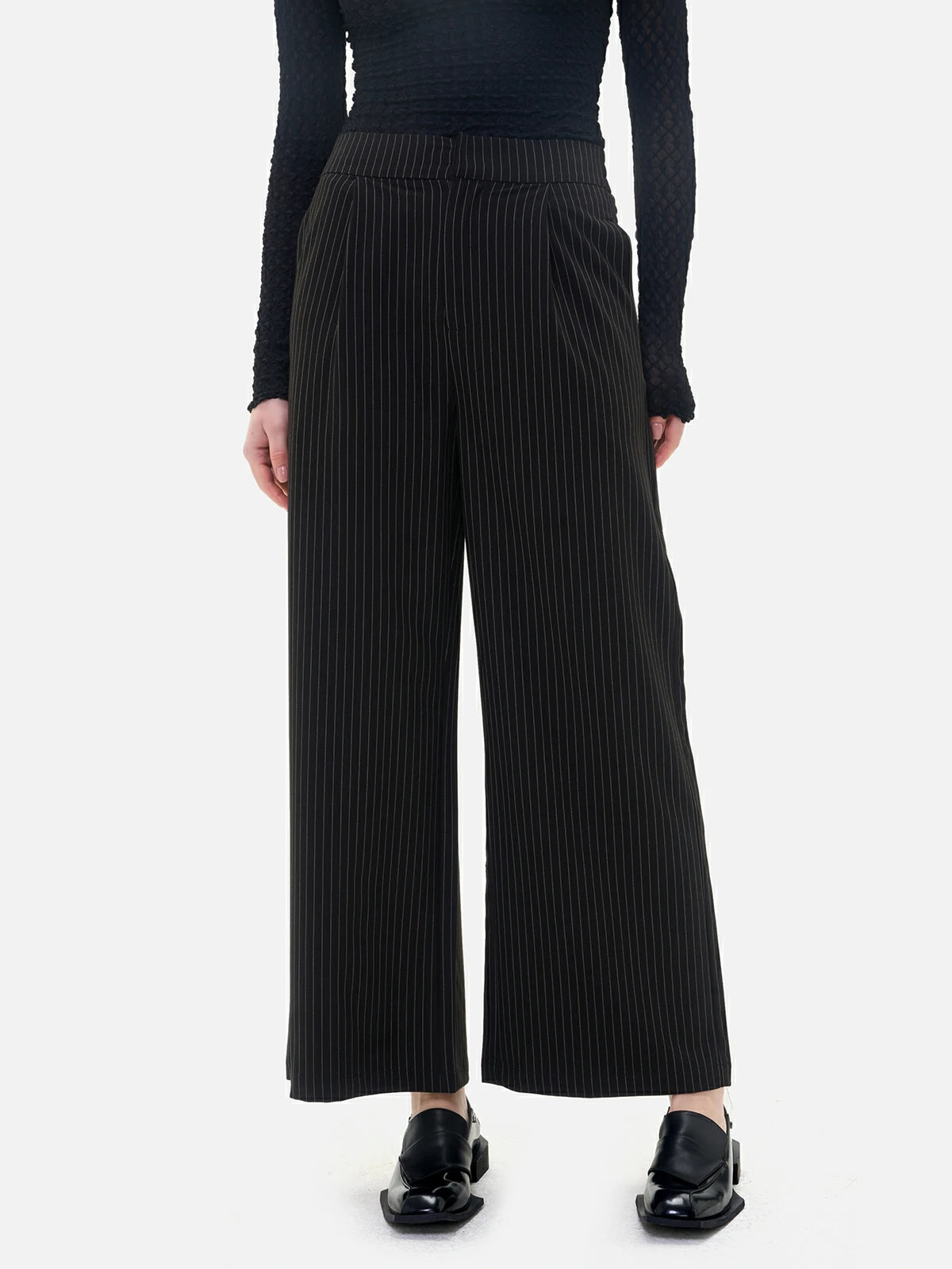 Elevate your style with these vertical stripe wide-leg pants, combining timeless elegance with fashionable comfort.