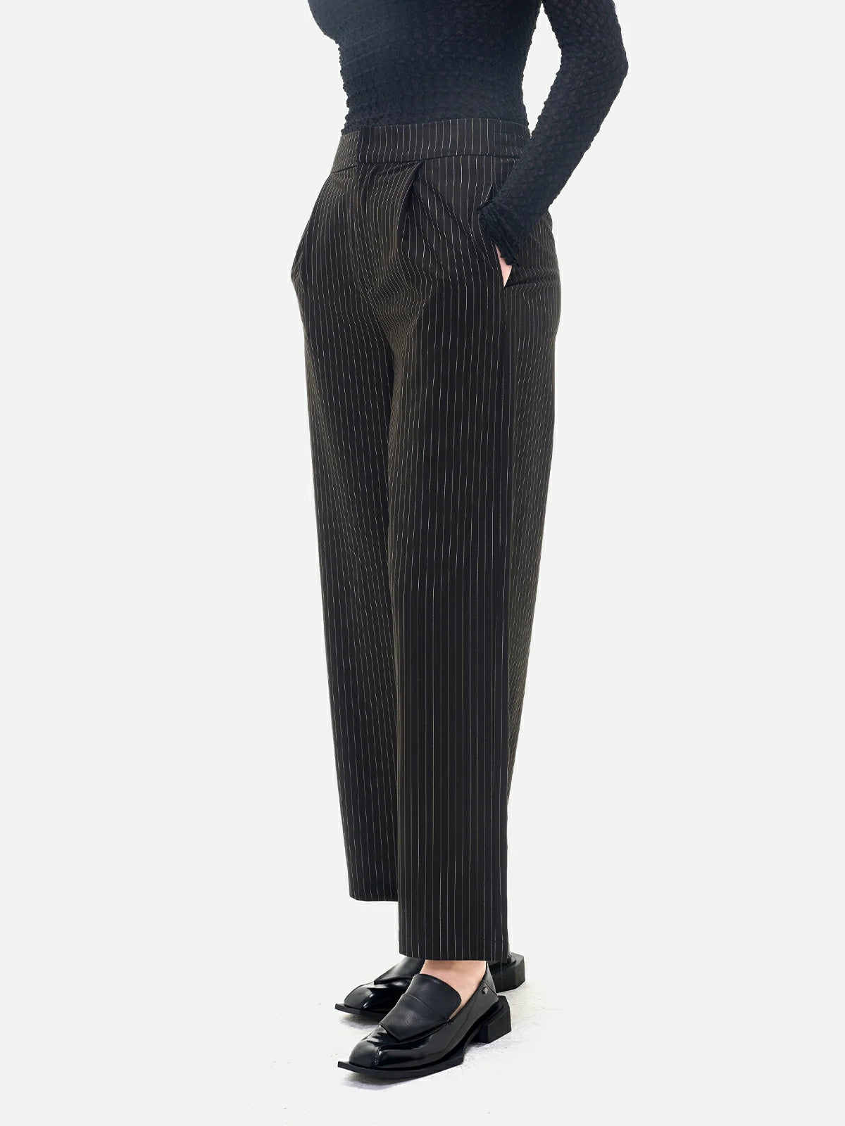 Embrace the classic allure of these wide-leg trousers featuring vertical stripes, offering both soft fabric and fluid lines.