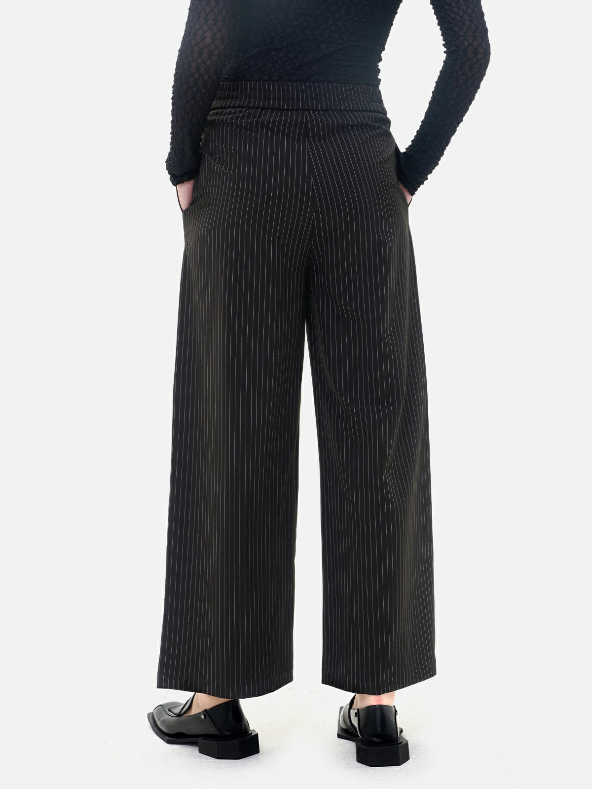 Transition seamlessly from office to casual settings with these wide-leg pants, boasting a classic vertical stripe design.