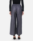 Natural pleat detailing creates a light and flowing quality in fashionable trousers