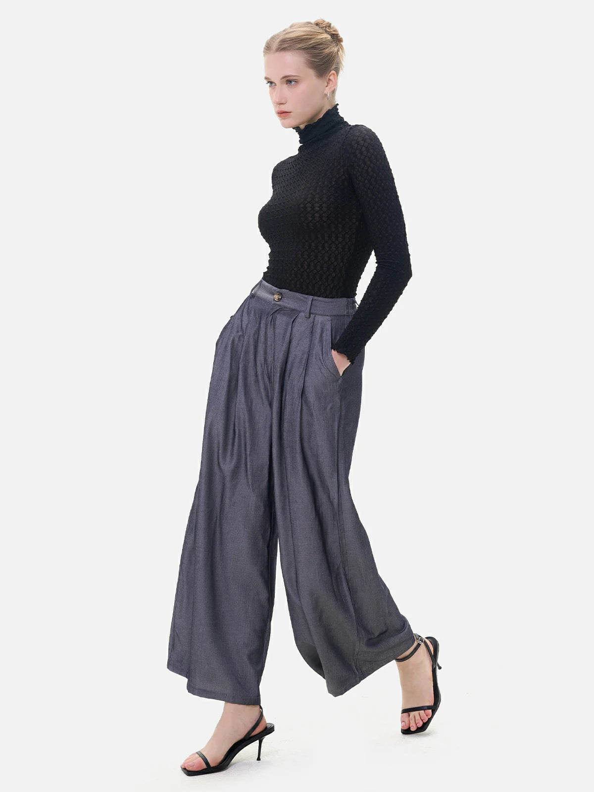 Feminine curve accentuation in trousers with elastic, button, and pleat designs
