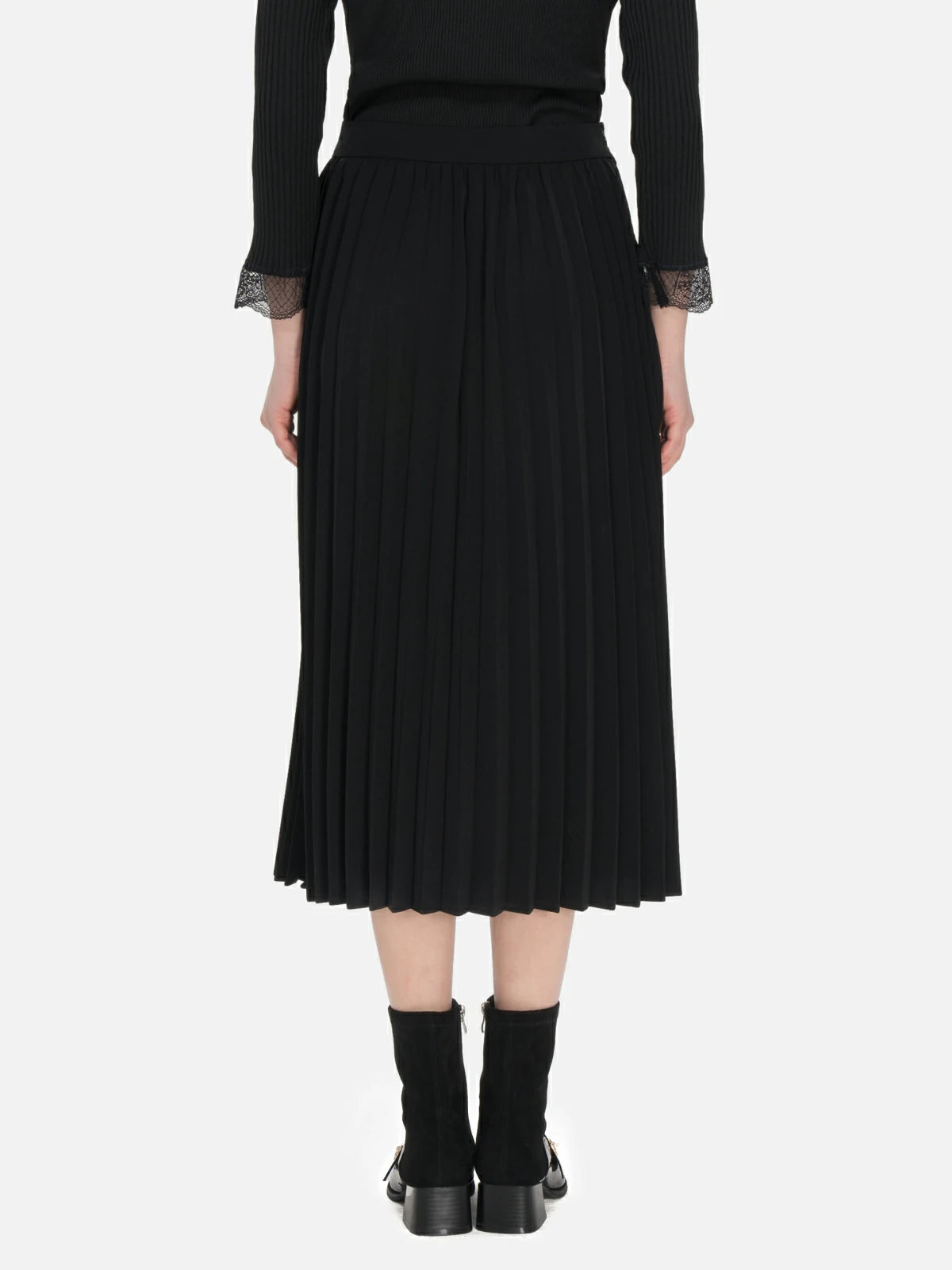 Artfully crafted pleats on a midi-length skirt for a dynamic and elegant appearance