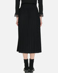 Artfully crafted pleats on a midi-length skirt for a dynamic and elegant appearance