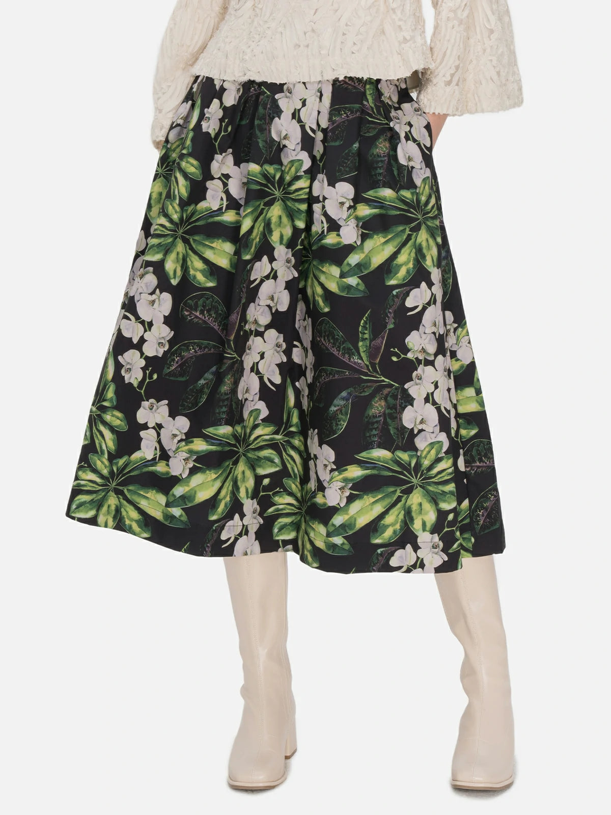 Tailored high-waisted A-line midi skirt adorned with a fresh color-blocked floral pattern and layered pleats, offering both a stylish and comfortable fit.