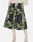 Tailored high-waisted A-line midi skirt adorned with a fresh color-blocked floral pattern and layered pleats, offering both a stylish and comfortable fit.