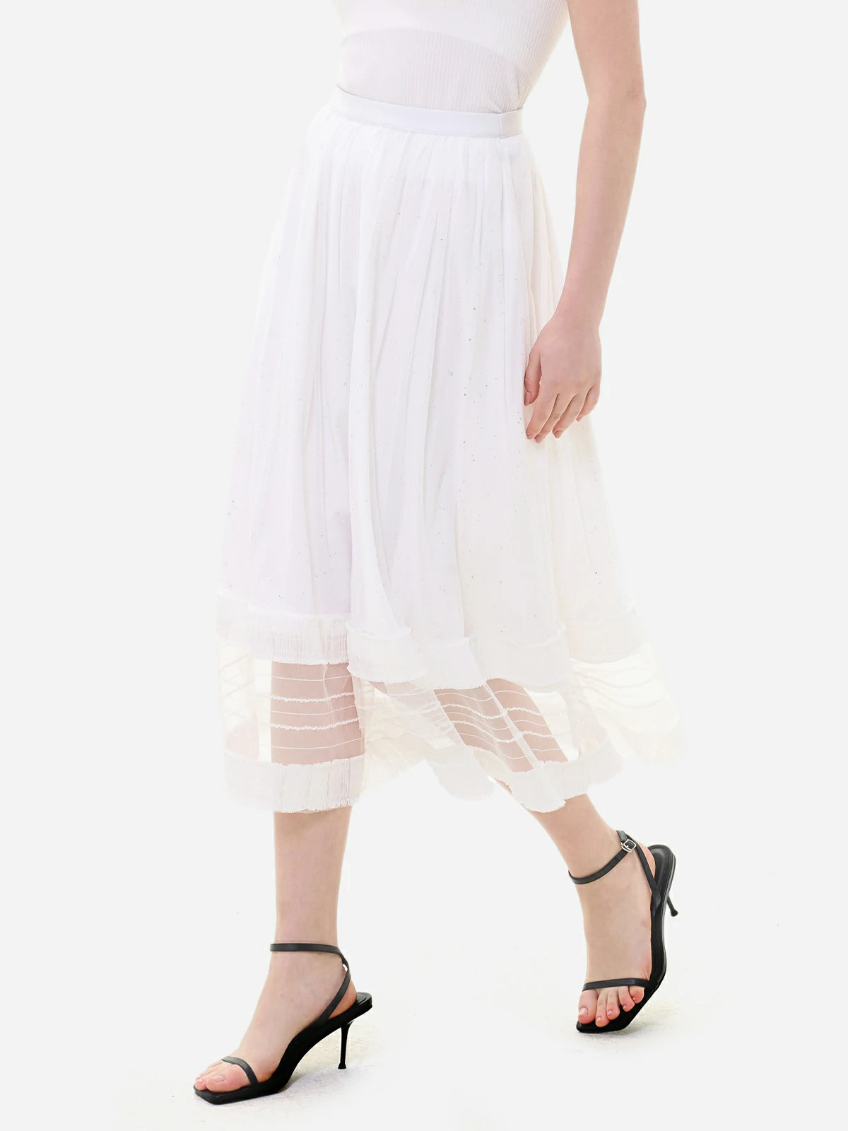 Feminine elegance and curves in a white skirt hem