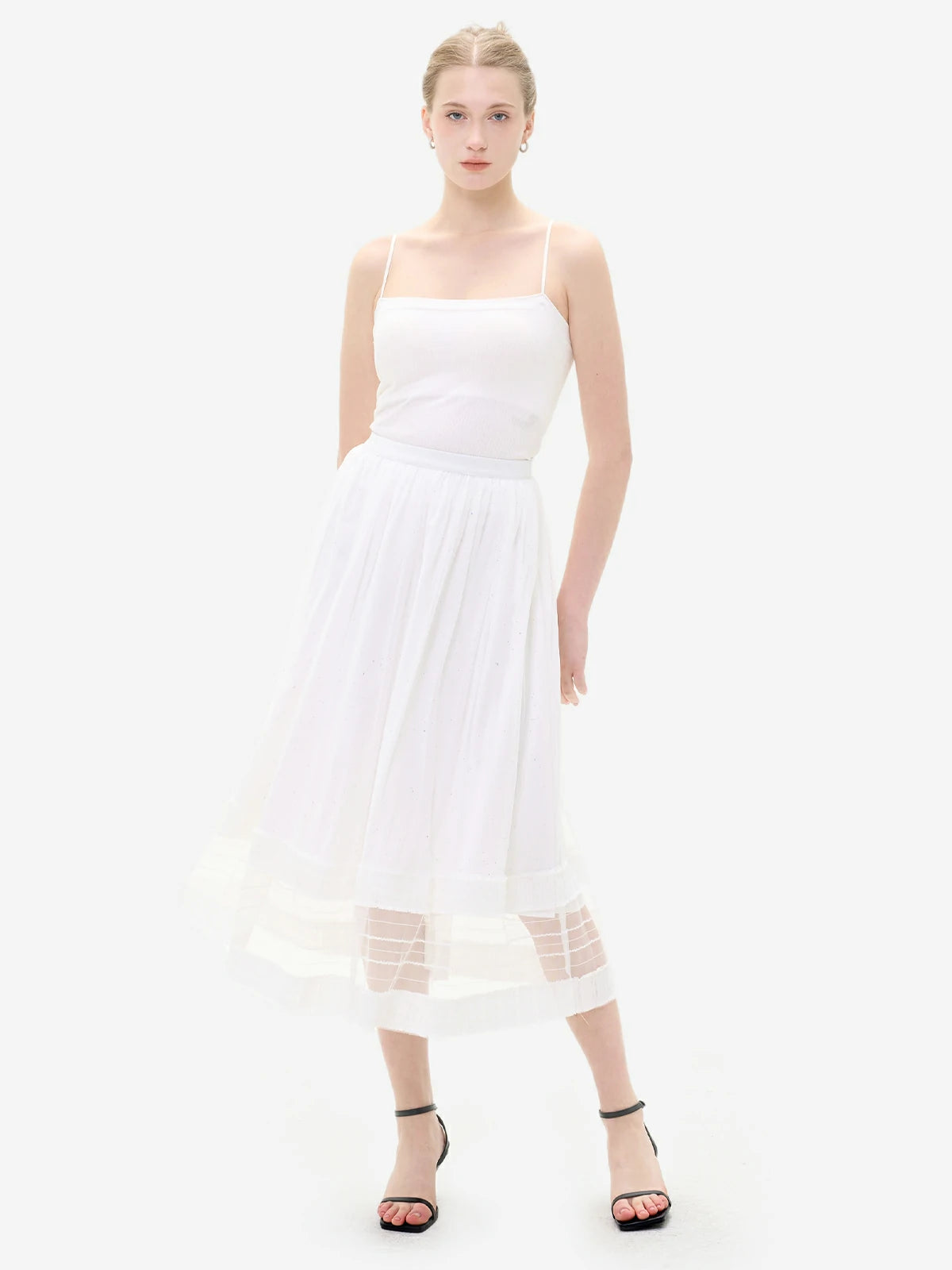 Romantic and feminine lace embellishments on a white skirt hem