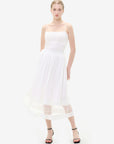 Romantic and feminine lace embellishments on a white skirt hem