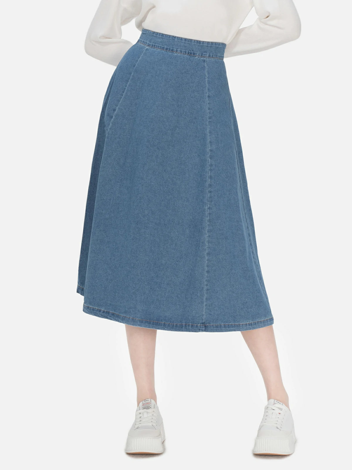 Classic blue denim A-line skirt with a high waist and timeless charm, offering a comfortable and stylish choice for everyday wear.