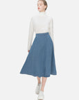 Timeless charm embodied in a blue denim A-line skirt with classic design, high waist, and versatile fashion, ensuring a comfortable and stylish fit for everyday use.