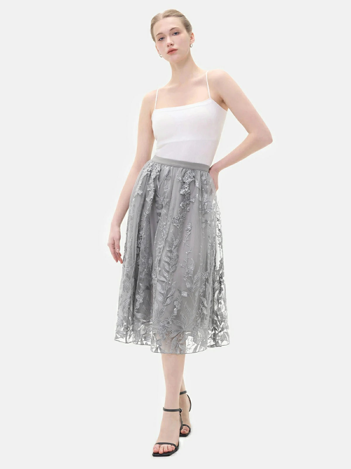 Make a statement in this elegant A-line tulle skirt, boasting an embroidered floral design, sequin embellishments, and an elastic waist