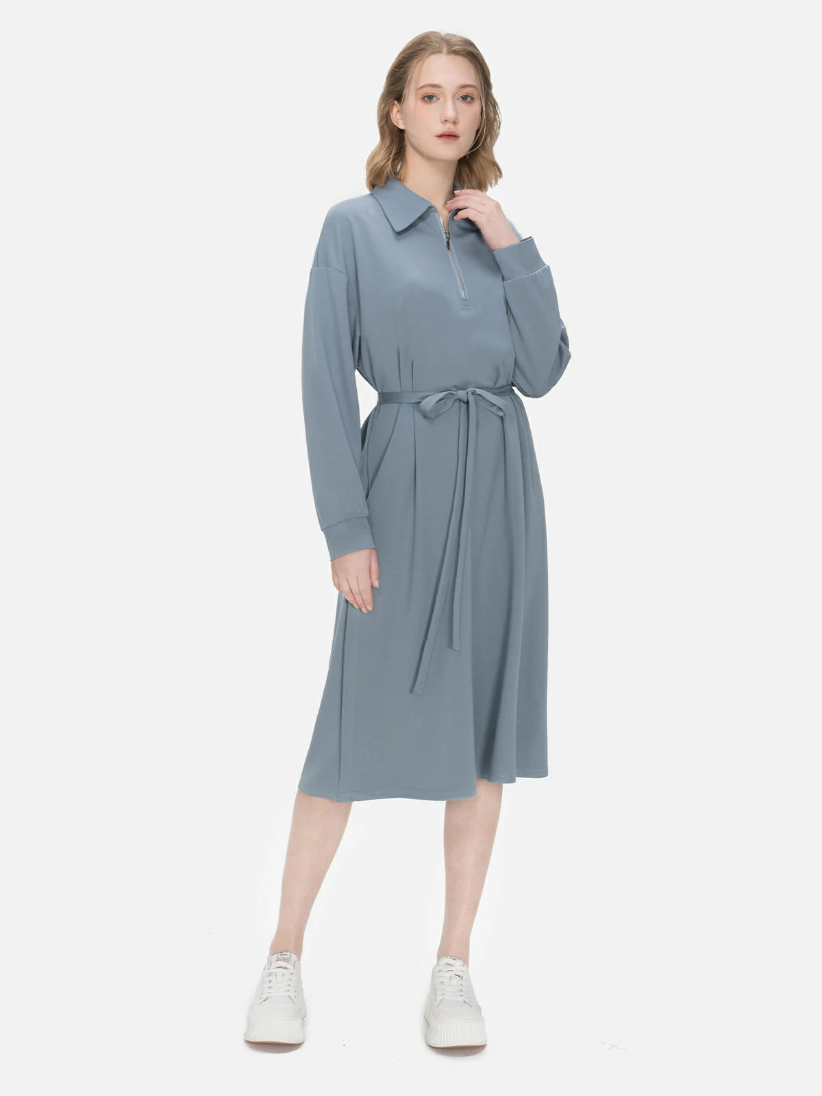 Versatile and fashionable midi dress with a blue-gray color palette, showcasing both classic and modern design elements.