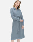 Tailored fit midi dress with a belted waist, collar, and front zipper detailing, combining comfort and style seamlessly.