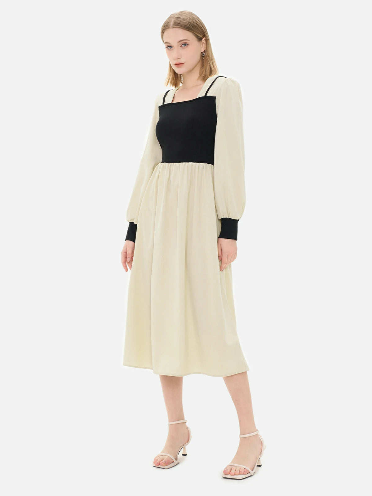 Square-neck dress with black sleeves and khaki skirt