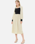 Square-neck dress with black sleeves and khaki skirt