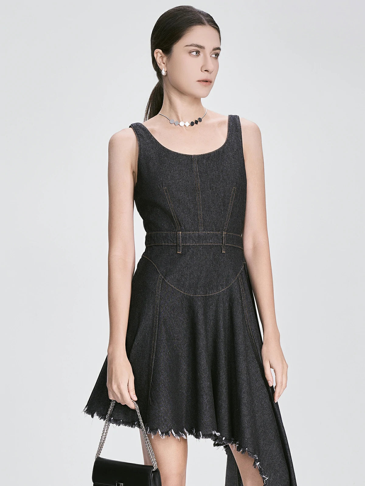 Black asymmetrical denim dress with sleeveless design and frayed hem