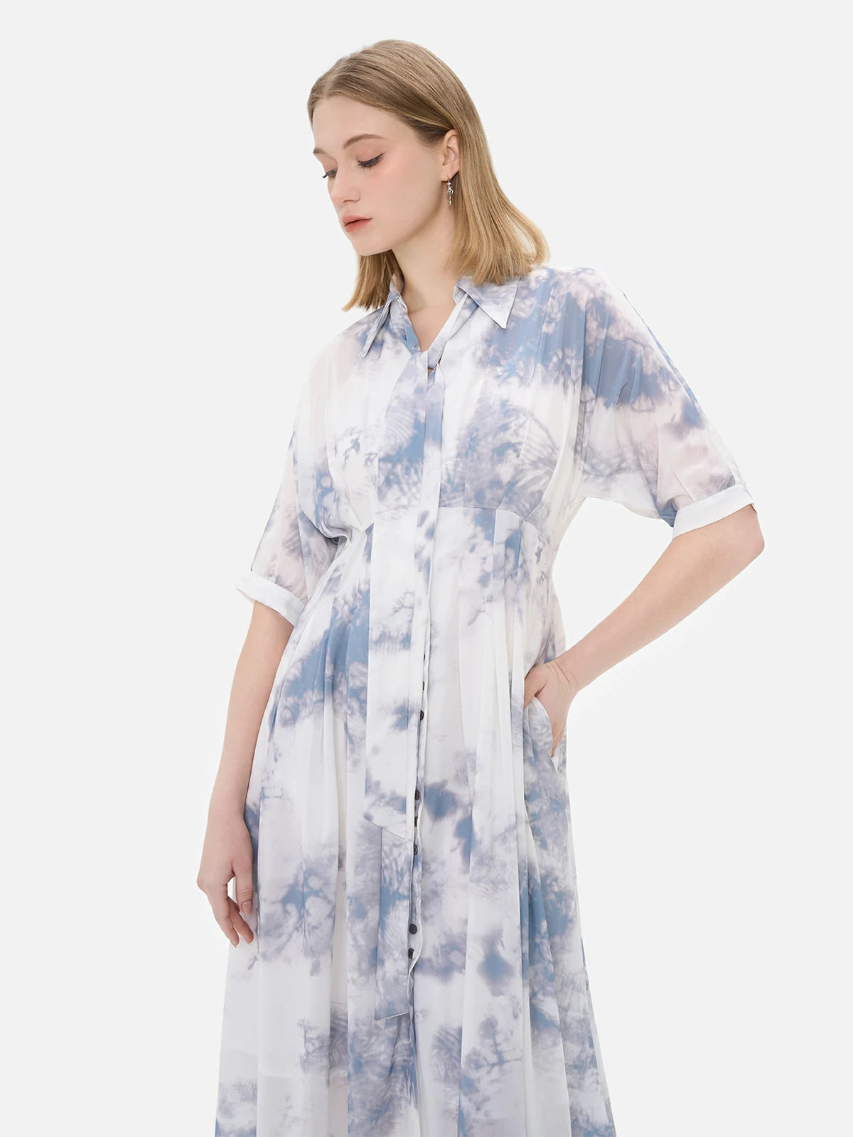 Unique ink wash blurring print design on a collared dress, blending classic and contemporary styles