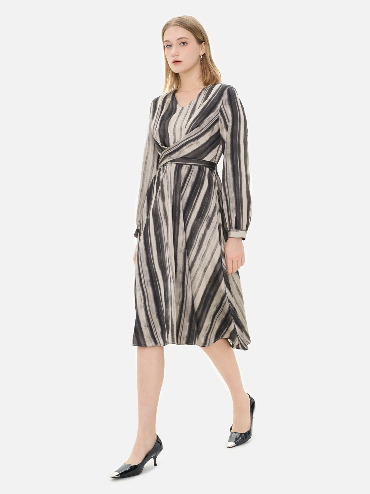 Fashionable women&#39;s dress with deep and light striped gradient, featuring a cinched waist.