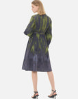 Embrace the artistry of fashion with this round-neck dress, a gray and green ombre effect, and a cinched waist design.