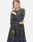 Effortlessly embody fashion versatility with this round-neck dress, a unique gray and green ombre, cinched waist design.