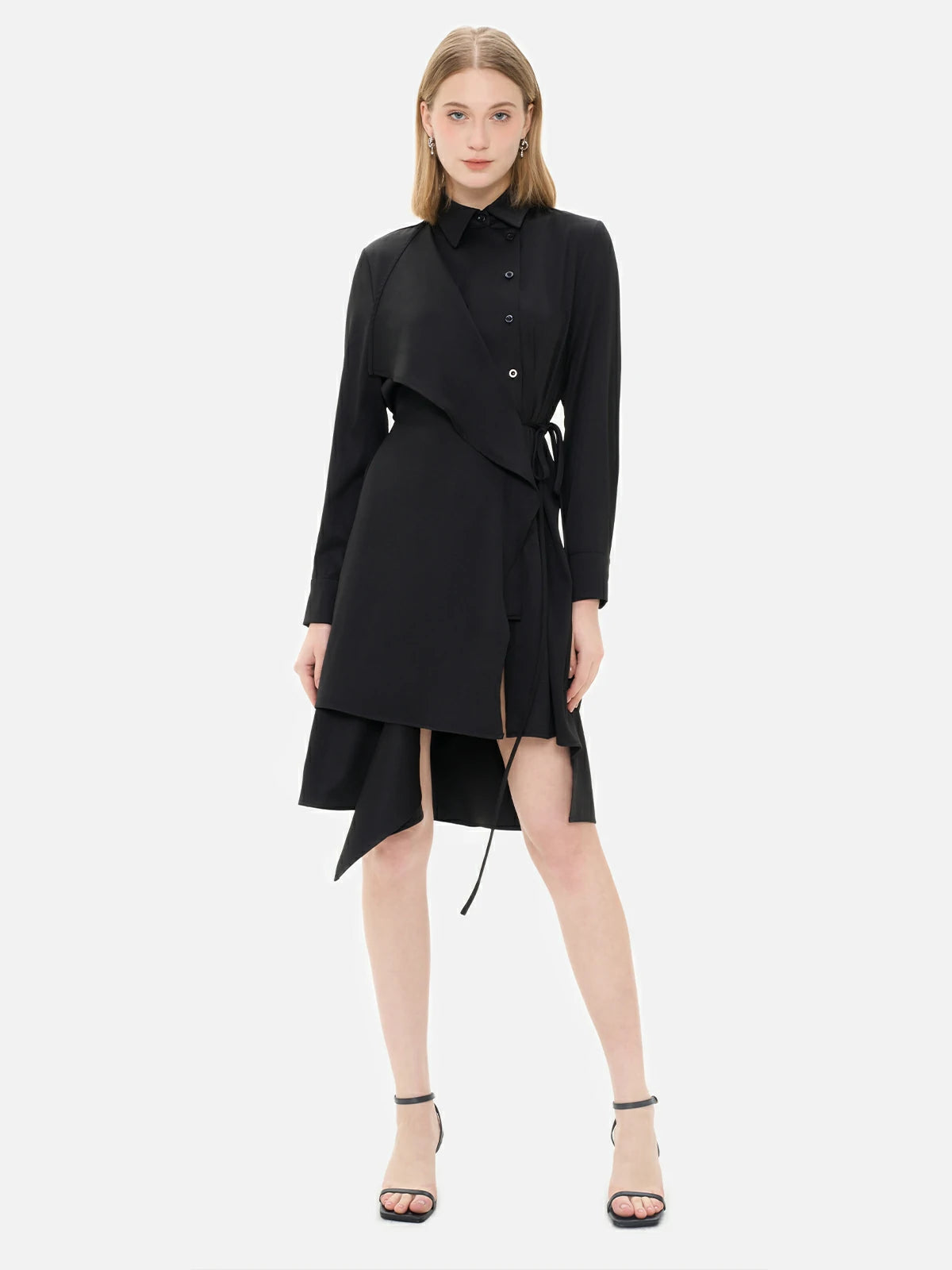 Elevate your style with this black shirt dress featuring a waist-tie accent, irregular hem, and front paneling.